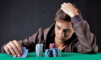 gambler-looking-at-cards-350